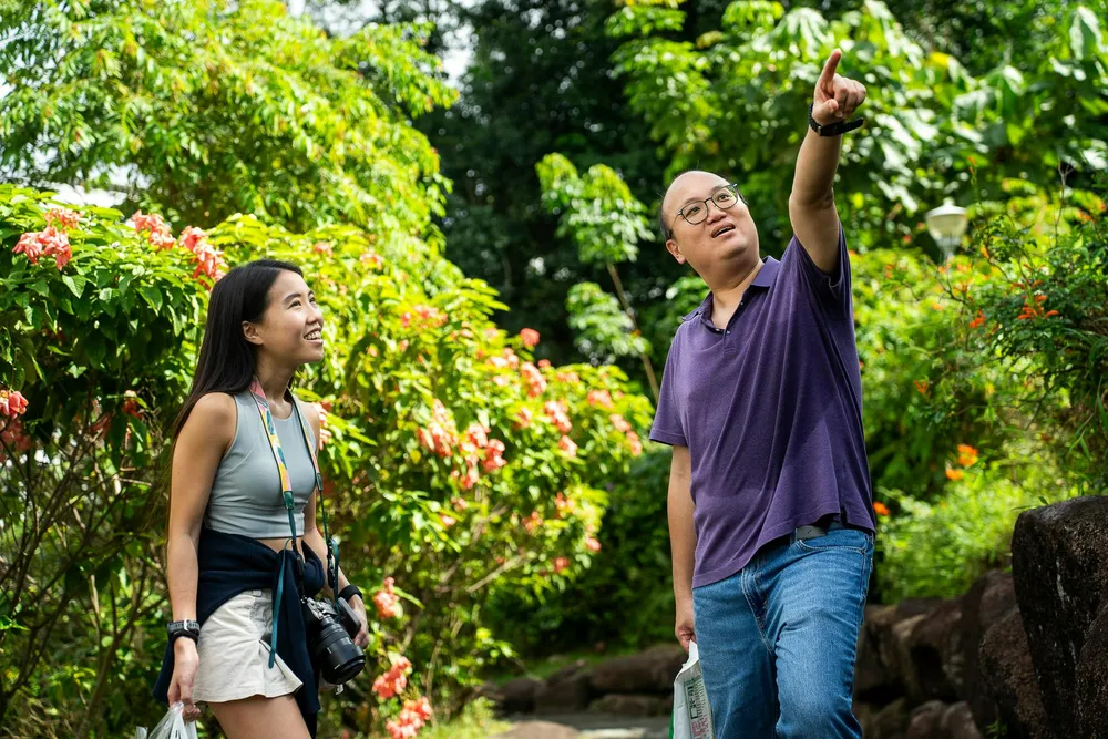 girl and guy exploring woodlands botanical gardens