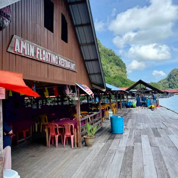 Anini Floating Restaurant on a wooden jetty at Kilim Geoforest during a sunset mangrove cruise in Langkawi