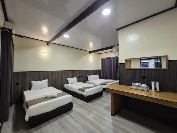 Beds and desk inside Sukau Greenview Lodge in Sandakan during a 2D1N B&B stay for the Kinabatangan River