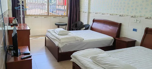 Twin guest beds in a simple room in Xishuangbanna, for the 2D1N Pu’er from Tree to Cup tea journey with Tea Origins