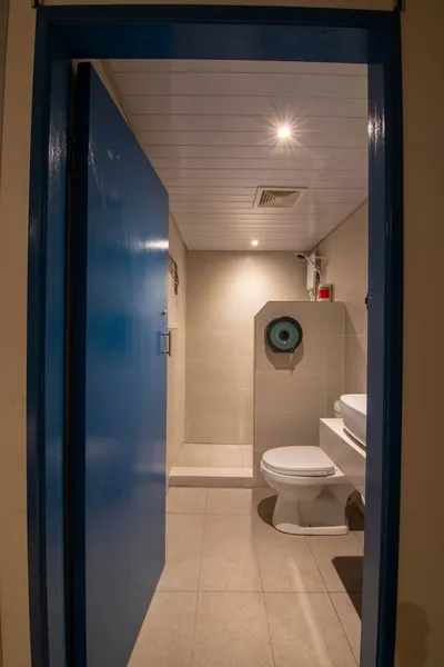Bathroom corridor on the Seaventures Dive Rig, a retired offshore oil rig stay in Semporna guest suite