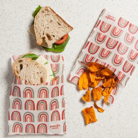 Bread and vegetable snacks wrapped in reusable cloth, set up for making food wraps at Agrihome sustainability workshops in Singapore