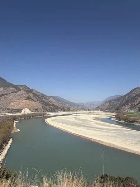 Curving Jinsha River and sandy bank in Tiger Leaping Gorge, viewed from the mountain trail near Lijiang