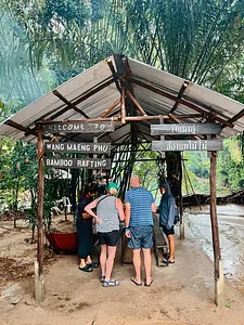 Guests enter a bamboo rafting station at Wang Maeng Phu, preparing for Half-Day Cycling & Rafting in Khao Lak