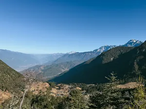 Viewpoint panorama of snow-capped peaks and deep mountain valleys across the landscapes of Jade Dragon Snow Mountain near Lijiang