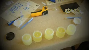 Coco-soy wax cups and fragrance tools laid out for blending with Perfume Play, a candle workshop in Singapore