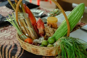 Basket of fresh prawns, herbs, ginger and greens laid out for Indigenous Sabahan cooking in Kota Kinabalu, Sabah