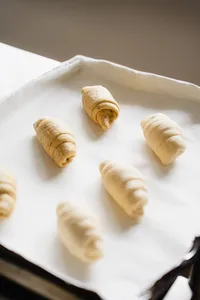 Shio pan dough pieces on a baking tray, ready for the oven during flavoured butter making workshops in Singapore
