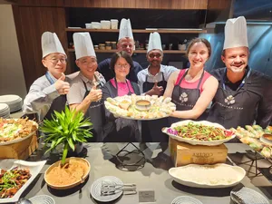 Coriander Leaf staff present prepared dishes and platters during the Local Produce Cooking Challenge for Teams in Singapore