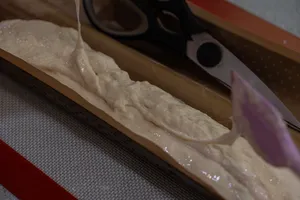 Baguette dough on a baking tray in the cosy loft kitchen with French Cooking Lab in Singapore — workshops in Singapore