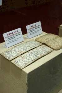 Welcome table with illustrated guides, folded maps, and name cards arranged at The Bivou Lijiang in Lijiang