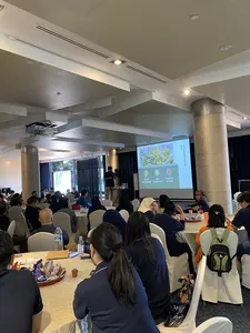 Workshop audience seated in a lecture room as Urban Green Dot presents sustainable microgreens for workshops in Singapore