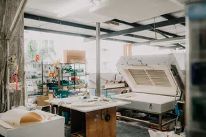 Glass studio in Singapore with a kiln and workbench for creating centrepieces, tools arranged—workshops in Singapore