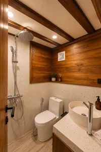 Travass Life new phinisi bathroom with a shower, toilet and countertop sink built into wood and stone, on a Komodo Island trip