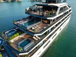 Top-down view of Doris Cruise decks with sunbeds and a small plunge pool on Halong Bay during a comfortable 2D1N cruise