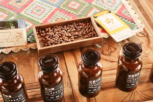 Tray of coffee beans above wooden shelves of labelled jars at Seeker Yunnan Coffee Estate in Lijiang