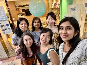 Art For Good art therapy in Singapore: group of participants posing at the studio entrance during workshops in Singapore