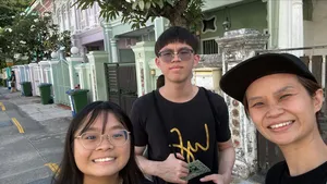 Team members posing for a selfie during a real-life Monopoly challenge in Katong-Joo Chiat, Singapore hidden gems