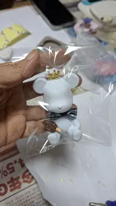 Crown-topped white marble scent stone figure in a clear bag, gift-ready from Unmi Lessons at workshops in Singapore