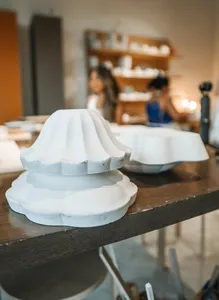 Ina Atelier studio table with handmade antique-style European ceramics plates and bowls, crafted for everyday dining workshops in Singapore