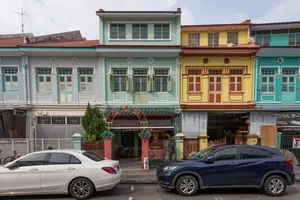Row of colourful heritage shophouses along Jalan Besar in Singapore, with cars parked in front, Singapore hidden gems
