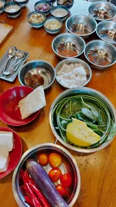 Ingredients for a Manggarai vegan cooking class—bowls of vegetables, herbs and grains—on a table in Labuan Bajo
