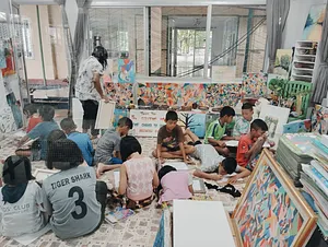 Children’s art and learning session at a community centre in Khao Lak, led by Hands Experiences Thailand for education impact