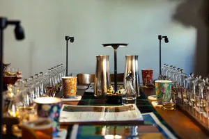 Small-batch whisky tasting table in a hidden Singapore home bar, with decanters and glassware ready for Scotch & Sambal