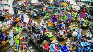 Crowded floating market of many boats selling fruit and vegetables along a river, a classic Ho Chi Minh City waterway transport scene
