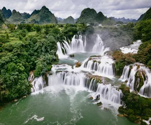 Verdant waterfalls on the 3-day Cao Bang motorbike loop near the China–Vietnam border, hosted by Ha Giang Expeditions