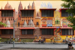 Vibrant mural wall with shopfront scenes behind parked bicycles on a Singapore street in Jalan Besar, Singapore hidden gems