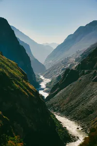 Scenic Tiger Leaping Gorge valley with a winding river, viewed from steep mountain trails near Shangri-La