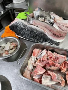 Fresh fish laid out on metal trays at a Singapore wet market during the Pasar Fish Chinatown Cantonese fish tour
