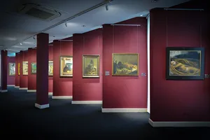 Visitors viewing Vietnamese artworks in gallery rooms at Quang San Art Museum during an expert-led tour in Ho Chi Minh City