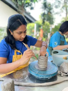 Pottery workshop on hand-building at 3Arts Pottery in Joo Chiat Place, Singapore, as a potter shapes a clay cup — workshops in Singapore