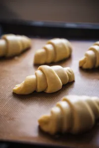 Croissant dough rolls on a baking mat, close-up at a French Cooking Lab class in Singapore, workshops in Singapore