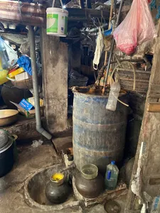 Hanoi Red River village workshop with metal drums, pipes and containers for low-waste traditional food making