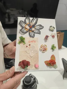 Handmade vision board with layered paper flowers during Gemstory vision boarding for birthday activities Singapore