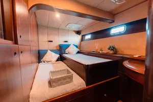 Mawali catamaran cabin in Kota Kinabalu, Sabah, with two bunks, pillows and a reading light for a restful overnight sail