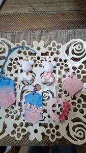 Pink and blue marble scent stone charms on a decorative tray, gift-ready for class purchases at workshops in Singapore
