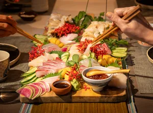 Assorted Japan-inspired grazing platter on a table with seafood, vegetables and dipping sauces at Primateve, private dining Singapore