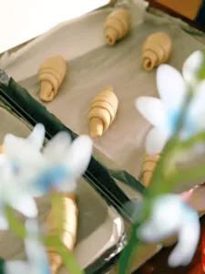 Rolled shio pan dough logs on baking paper during hands-on bread workshops in Singapore with The Daily Staples host
