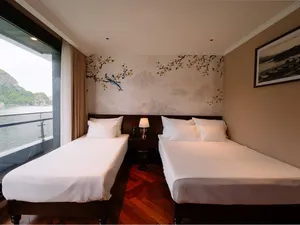 Sunshine Golden Cruises Cat Ba cruise cabin with two twin beds and a large window overlooking the bay on a 2D1N stay