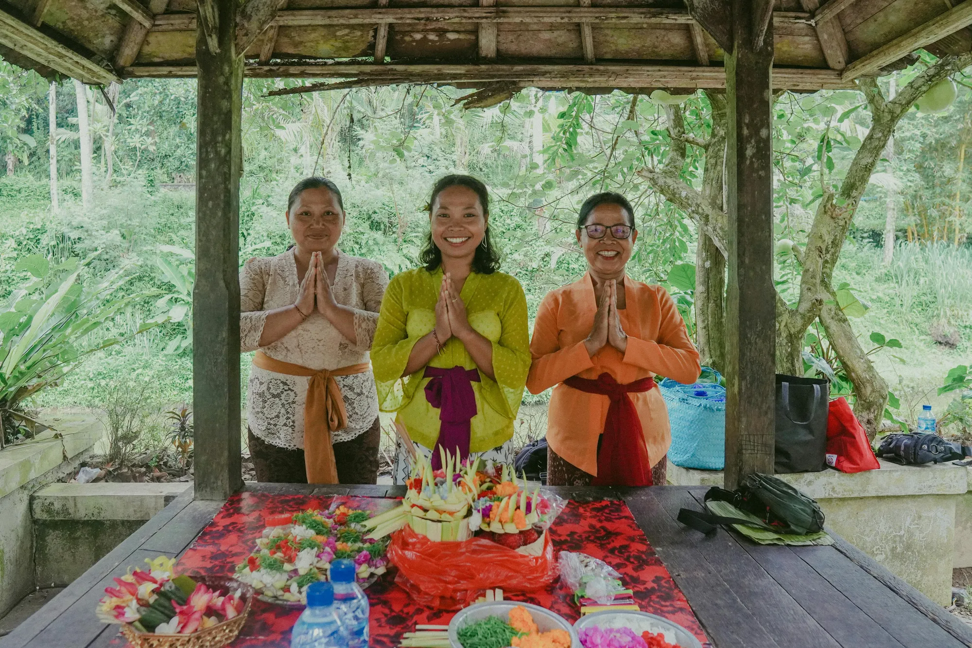 The Balinese guide carrying on her grandmother's Melukat